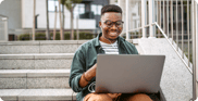 man-outside-on-laptop